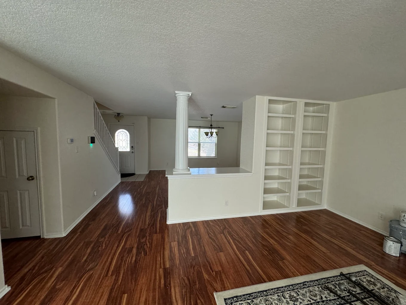 Exterior front door painted in deep navy blue with stone surround