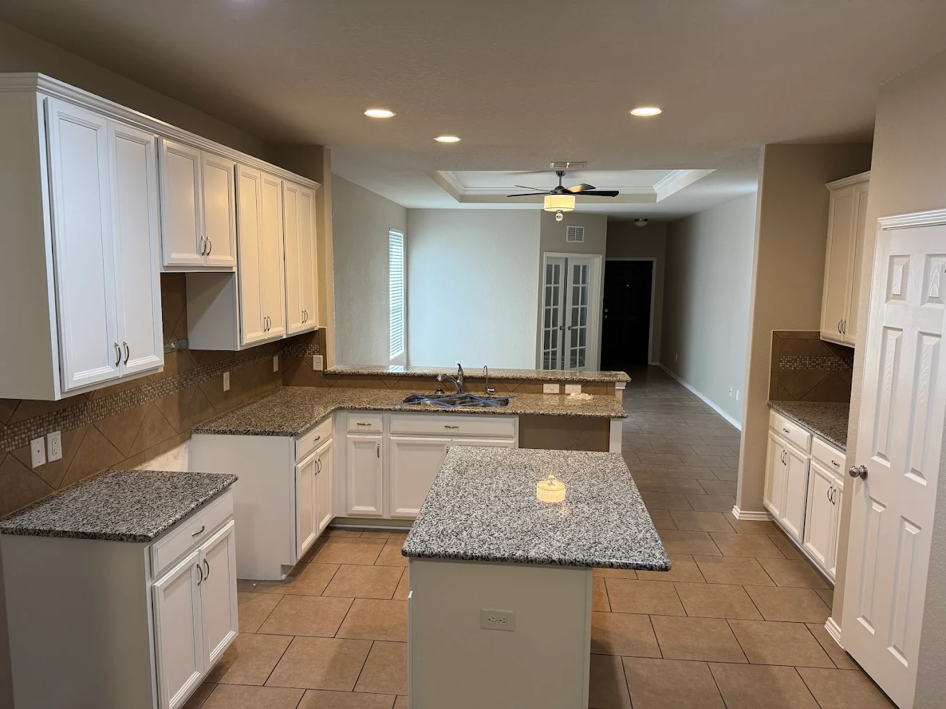 Interior kitchen painting with white cabinets and clean walls